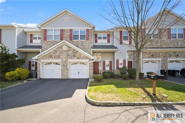 21 Capica Ct Unit 89, South Amboy, NJ 08879 - townhome / multi-family property with stone siding, an attached garage, and asphalt driveway