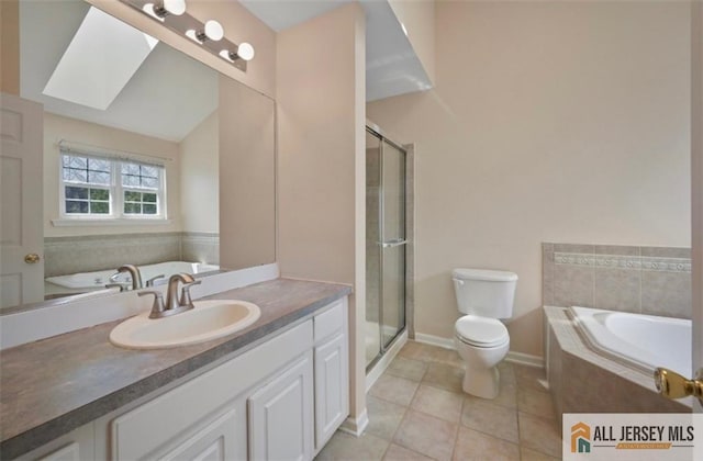 21 Capica Ct Unit 89, South Amboy, NJ 08879 - full bathroom featuring a skylight, vanity, a garden tub, and tile patterned flooring