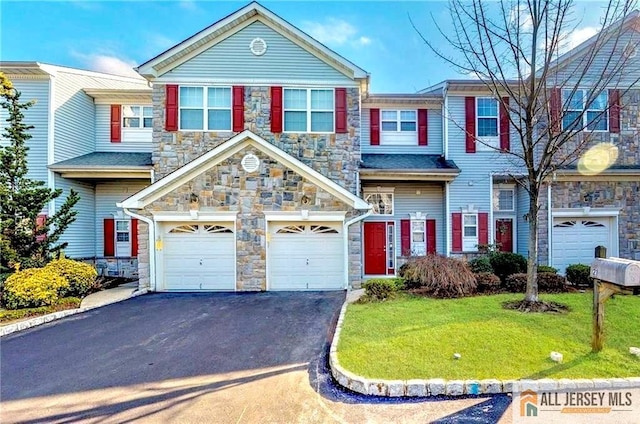 21 Capica Ct Unit 89, South Amboy, NJ 08879 - multi unit property with an attached garage, stone siding, asphalt driveway, and a front yard