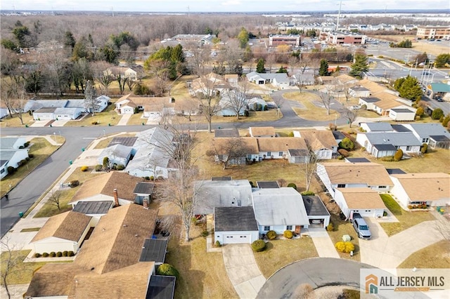 birds eye view of property with a residential view