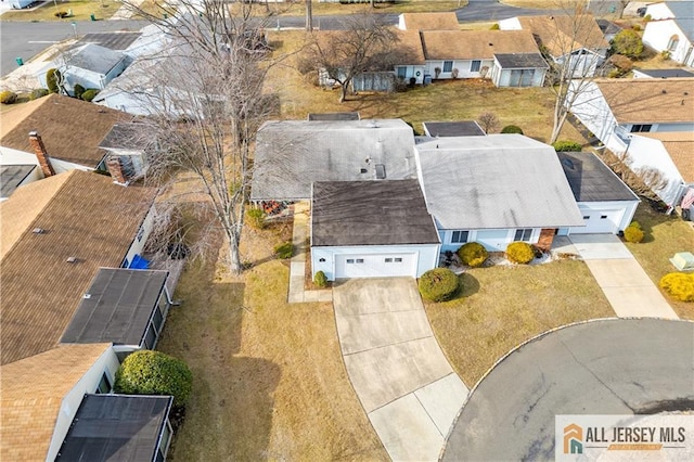 birds eye view of property with a residential view