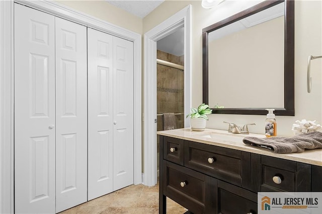 bathroom featuring a closet and vanity