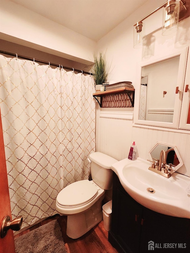 539 Locust Ave, Garwood, NJ 07027 - full bathroom with vanity, wood finished floors, and wainscoting