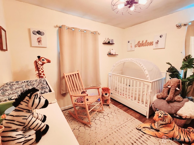 539 Locust Ave, Garwood, NJ 07027 - bedroom with wood finished floors and a crib