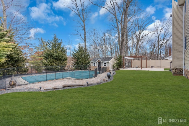 896 Kearney Dr, North Brunswick, NJ 08902 - view of swimming pool featuring an outdoor structure, a fenced in pool, a fenced backyard, and a patio