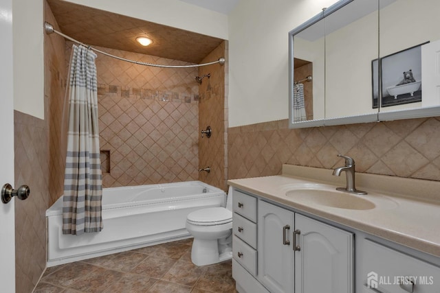 896 Kearney Dr, North Brunswick, NJ 08902 - bathroom featuring tile walls, toilet, vanity, shower / bath combination with curtain, and wainscoting