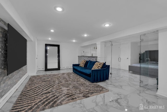 living room featuring recessed lighting, marble finish floor, baseboard heating, and baseboards