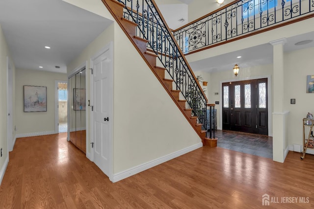 896 Kearney Dr, North Brunswick, NJ 08902 - entrance foyer featuring stairs, wood finished floors, recessed lighting, a high ceiling, and baseboards