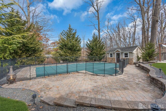 896 Kearney Dr, North Brunswick, NJ 08902 - view of pool featuring an outdoor structure, fence, a fenced in pool, and a patio area