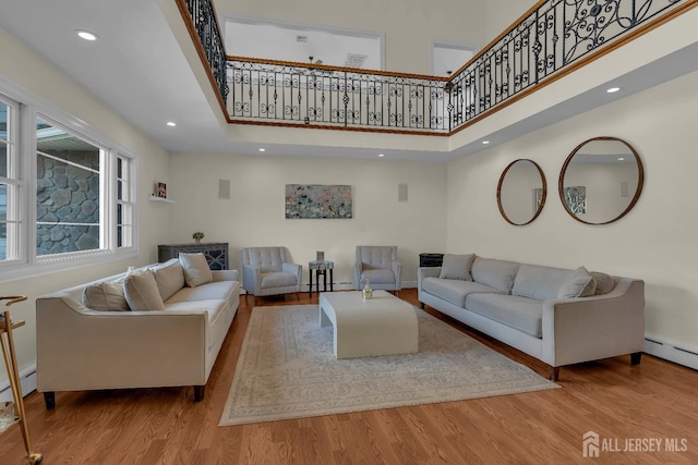 896 Kearney Dr, North Brunswick, NJ 08902 - living room featuring baseboards, recessed lighting, a towering ceiling, and wood finished floors