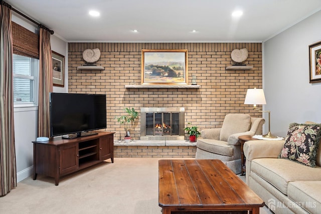 living room featuring a fireplace, crown molding, and light colored carpet