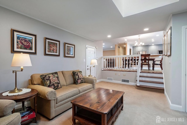 carpeted living room featuring a chandelier and crown molding