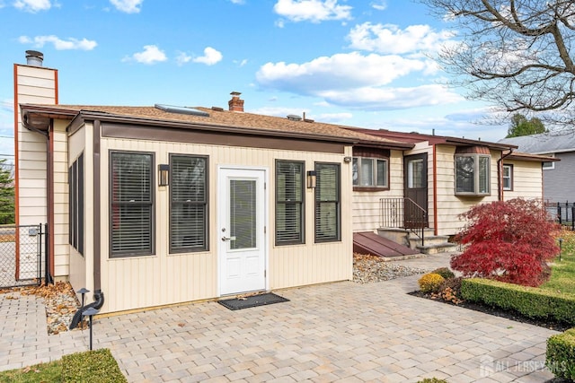 rear view of property featuring a patio area