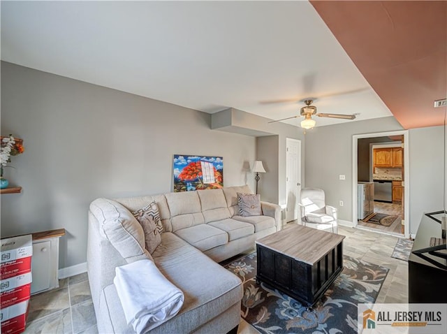 living room featuring a ceiling fan, visible vents, and baseboards