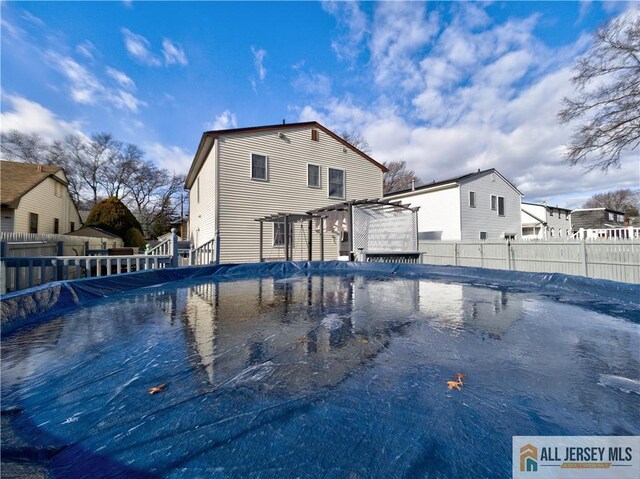 view of pool with a pergola