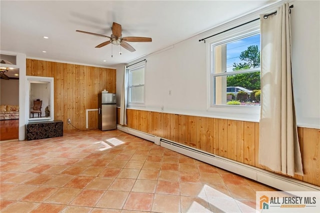 8 Harold Ave, Edison, NJ 08820 - empty room with wooden walls, baseboard heating, a ceiling fan, and recessed lighting