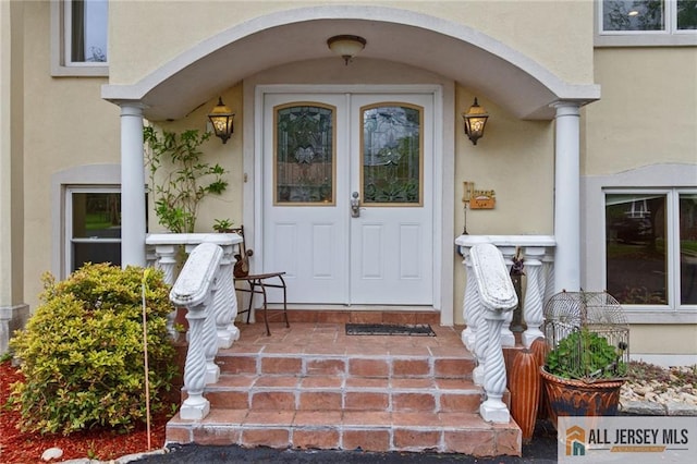 8 Harold Ave, Edison, NJ 08820 - property entrance with stucco siding and covered porch