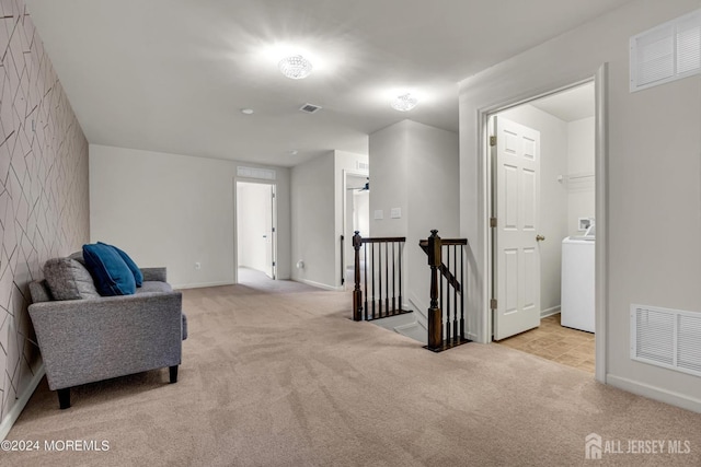 44 Begonia Ln, Monroe, NJ 08831 - living area with an upstairs landing, light carpet, and washer / dryer