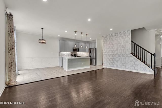 44 Begonia Ln, Monroe, NJ 08831 - unfurnished living room featuring ornamental molding, light wood-style flooring, stairway, recessed lighting, and a wainscoted wall