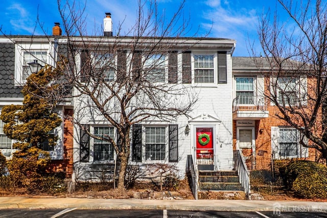 view of property with brick siding