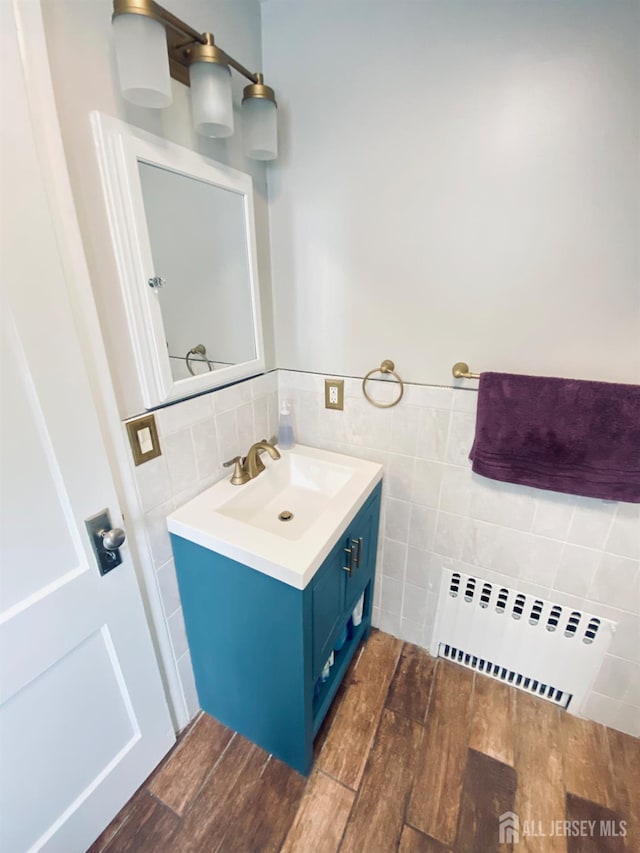 142 Liberty St, Fords, NJ 08863 - bathroom with vanity, wood finished floors, and tile walls