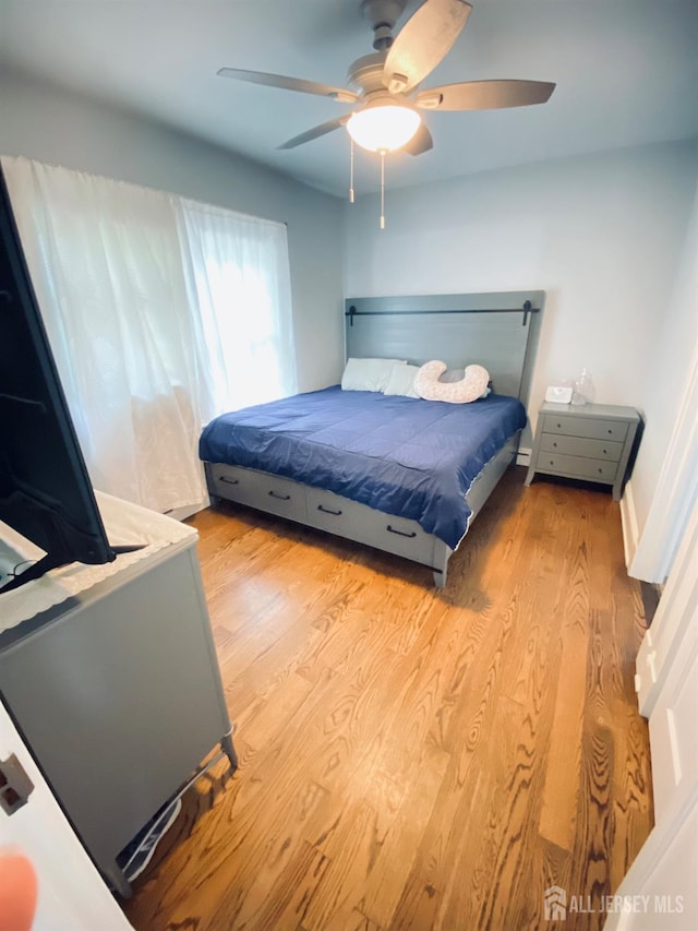 142 Liberty St, Fords, NJ 08863 - bedroom featuring wood finished floors and a ceiling fan