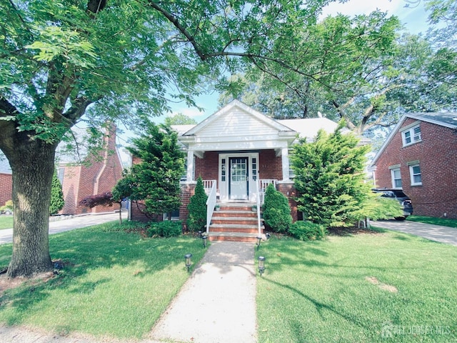 142 Liberty St, Fords, NJ 08863 - view of front of home with a front lawn and brick siding