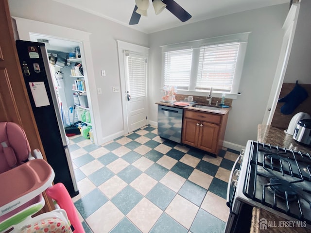 142 Liberty St, Fords, NJ 08863 - kitchen with stainless steel appliances, brown cabinets, and a ceiling fan