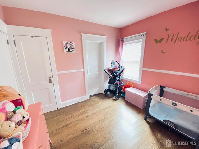 142 Liberty St, Fords, NJ 08863 - bedroom featuring wood finished floors and baseboards