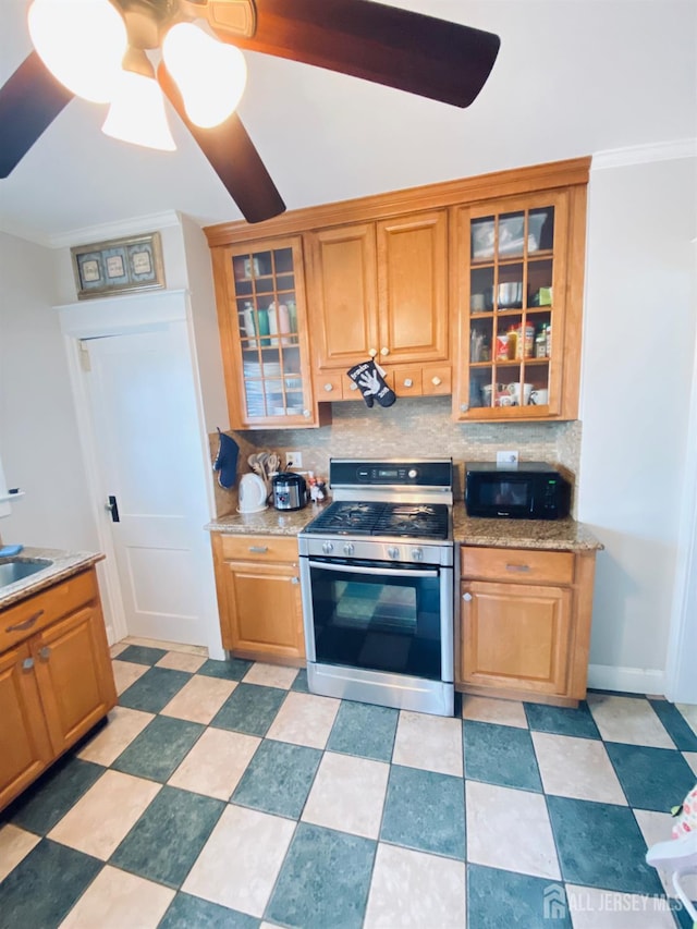 142 Liberty St, Fords, NJ 08863 - kitchen featuring stainless steel range with gas stovetop, ceiling fan, backsplash, and glass insert cabinets
