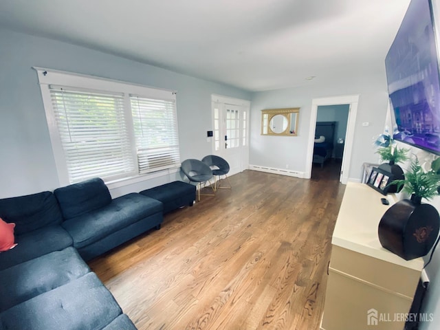 142 Liberty St, Fords, NJ 08863 - living area with baseboard heating and wood finished floors
