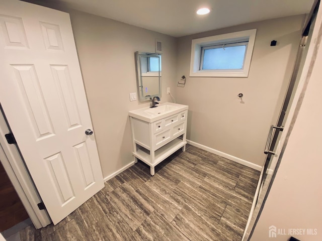 142 Liberty St, Fords, NJ 08863 - bathroom featuring vanity, recessed lighting, and wood finished floors