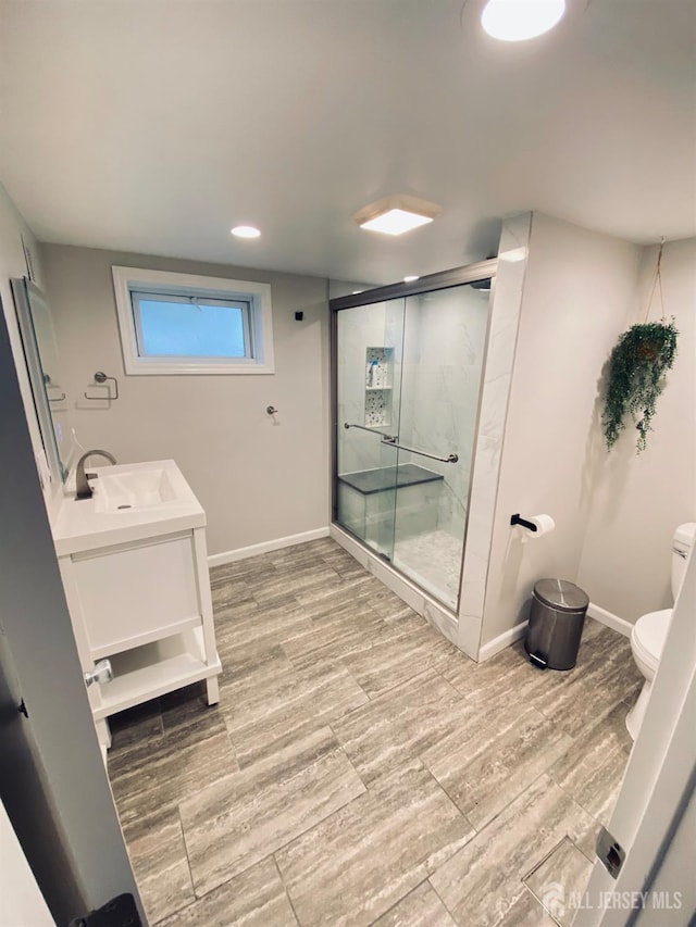 142 Liberty St, Fords, NJ 08863 - bathroom featuring a stall shower, vanity, wood finished floors, and recessed lighting
