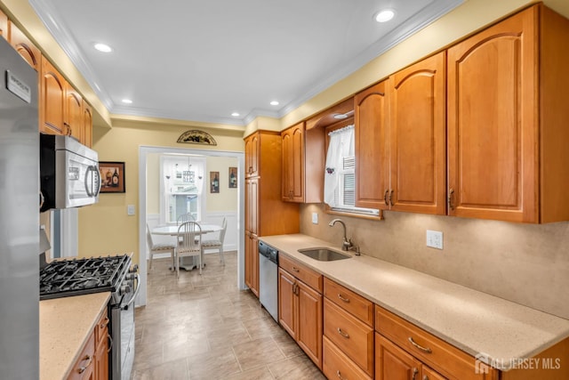 143 Emerson St, Carteret, NJ 07008 - kitchen featuring stainless steel appliances, ornamental molding, brown cabinets, light stone counters, and recessed lighting