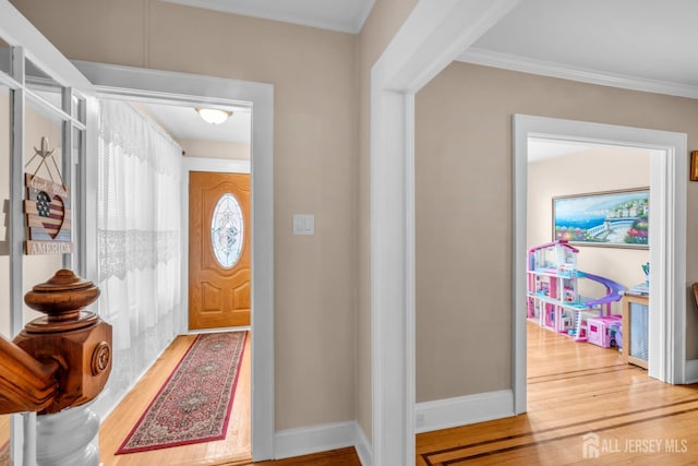 143 Emerson St, Carteret, NJ 07008 - entrance foyer with wood finished floors and ornamental molding