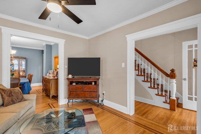143 Emerson St, Carteret, NJ 07008 - living area with wood finished floors, a ceiling fan, ornamental molding, and stairway