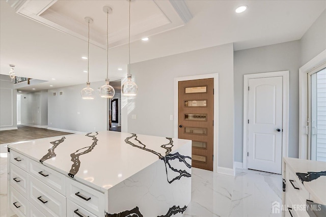 kitchen featuring recessed lighting, hanging light fixtures, white cabinets, a raised ceiling, and marble finish floor