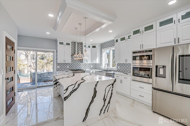 kitchen with backsplash, marble finish floor, appliances with stainless steel finishes, and white cabinetry