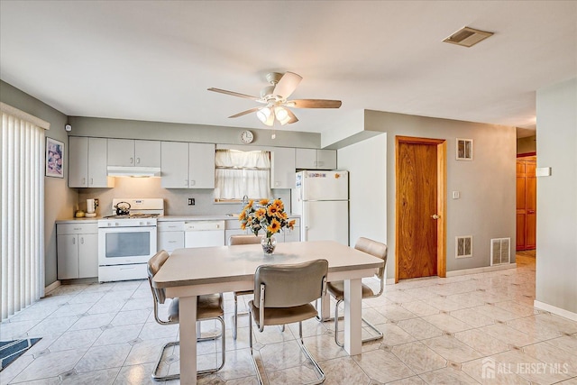 kitchen with white appliances and ceiling fan