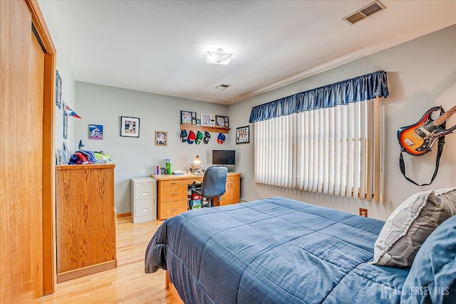 bedroom with wood-type flooring