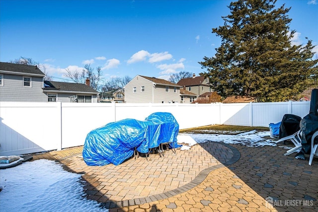 view of patio featuring a residential view and a fenced backyard