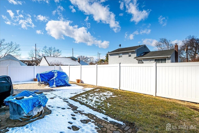 view of yard with a fenced backyard