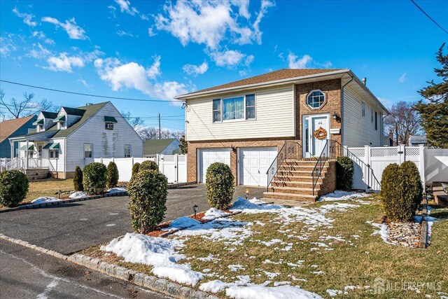 view of front of home with a garage