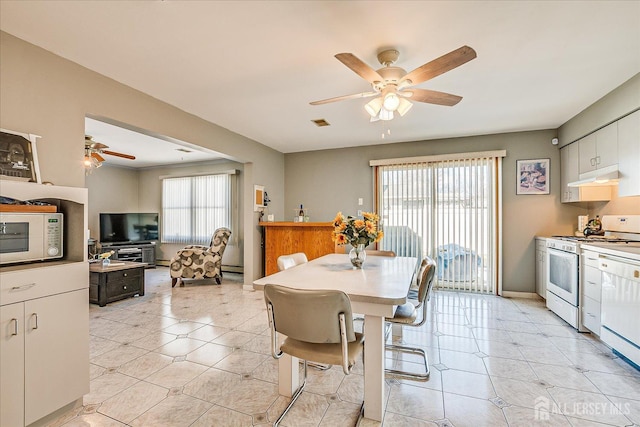 dining room with ceiling fan and light tile patterned floors