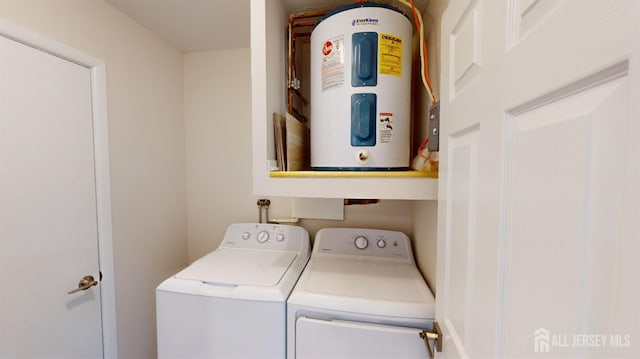 washroom featuring washer and clothes dryer and electric water heater