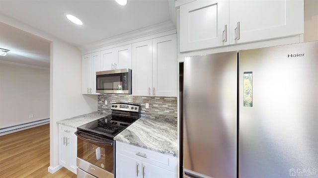 kitchen featuring tasteful backsplash, light hardwood / wood-style flooring, stainless steel appliances, white cabinets, and light stone counters