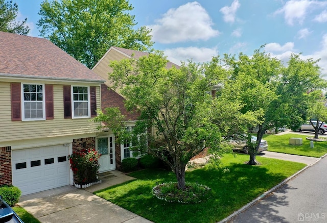 view of front of home with a front lawn and a garage