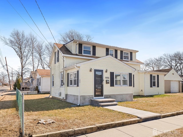 view of front of house with a front yard and a garage