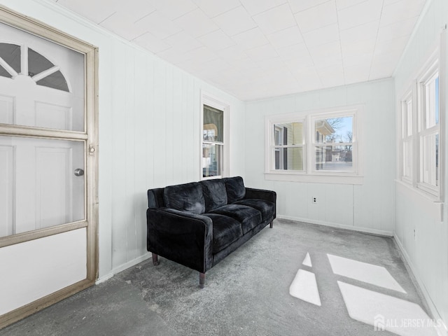 interior space featuring carpet and baseboards
