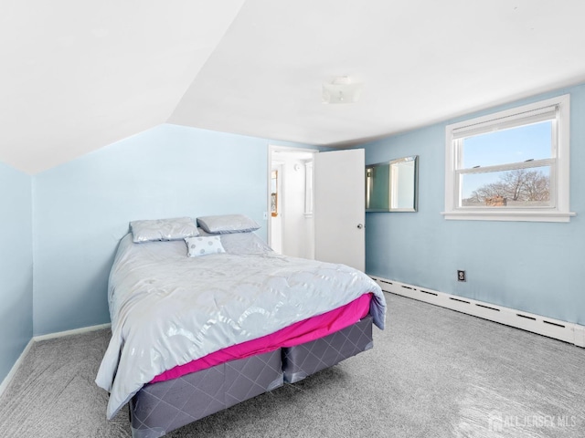 bedroom featuring lofted ceiling, a baseboard radiator, and carpet floors